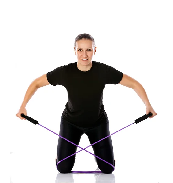 Woman with rubber resistance band — Stock Photo, Image