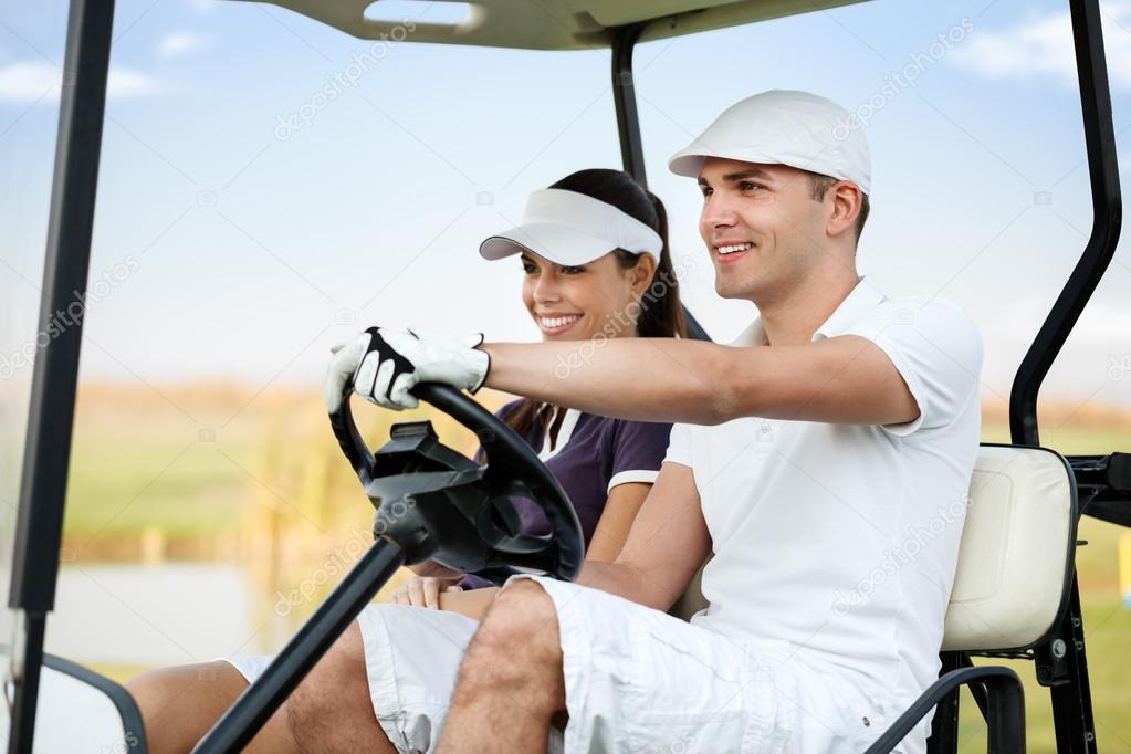 Couple in golf car