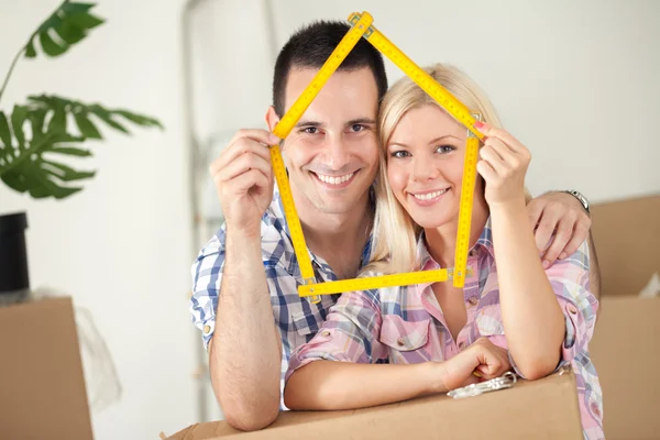 Happy couple in new house — Stock Photo, Image