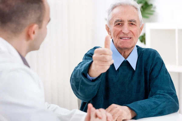 Satisfied patient at doctor Royalty Free Stock Photos