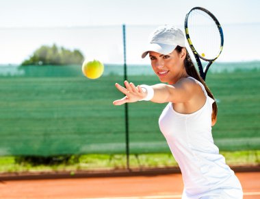 Female playing tennis clipart