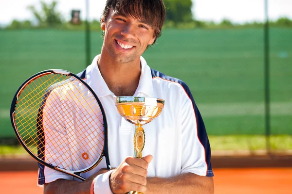 Usmívající se tenis vítěz — Stock fotografie