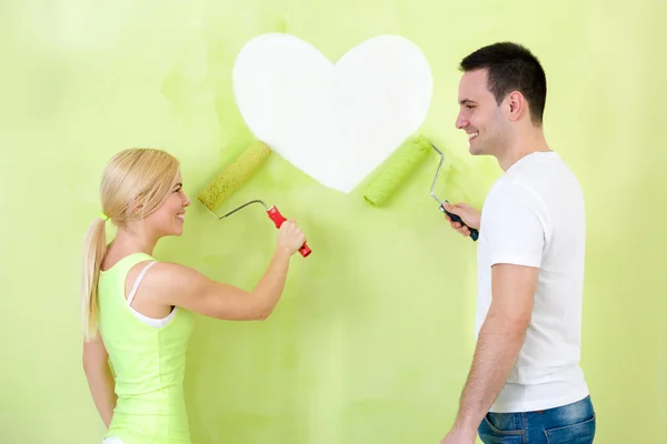 Pareja pintura corazón en la pared —  Fotos de Stock