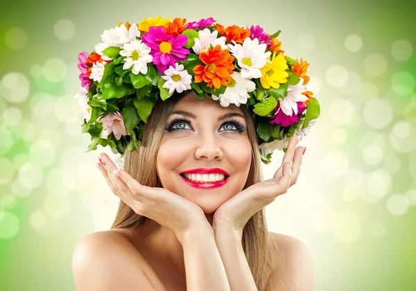 Beauty woman with wild of fresh flowers — Stock Photo, Image