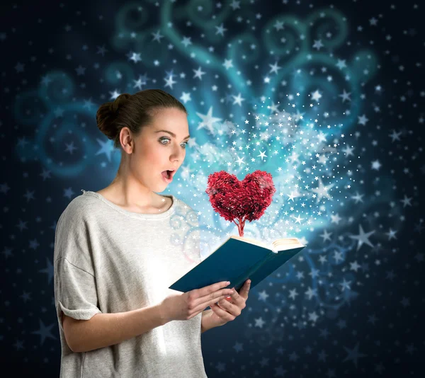 Young woman with magic book — Stock Photo, Image