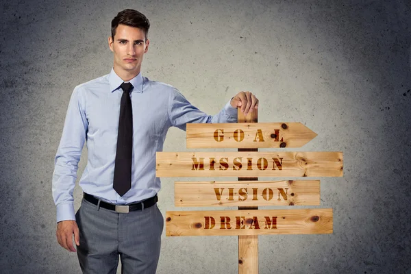 Success businessman with wooden sign — Stock Photo, Image