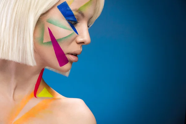 Fashion woman with triangles on the face — Stock Photo, Image