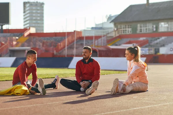 Group Three Athletes Stretching Together Practice — Stock Photo, Image