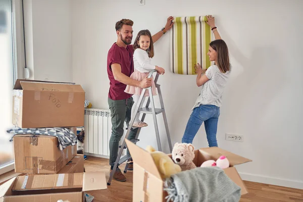 Young Caucasian Family Three Having Fun Daughter Standing Ladder Choosing — Stock Photo, Image