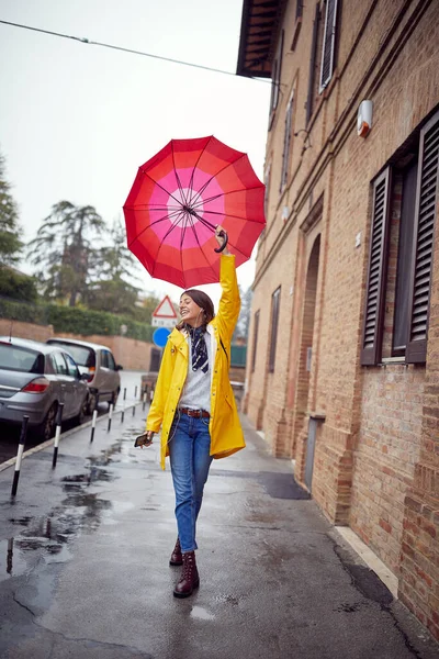 Happy Girl Yellow Coat Red Umbrella Walking Enjoying Rainy Day — Stock Photo, Image