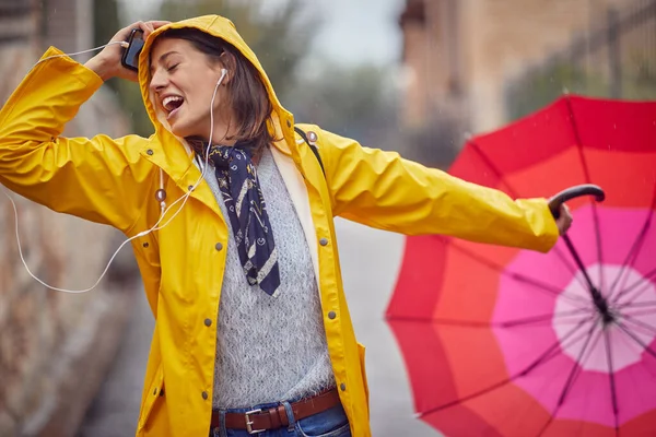 Close Young Cheerful Woman Yellow Raincoat Who Enjoying While Listening — Stock Photo, Image