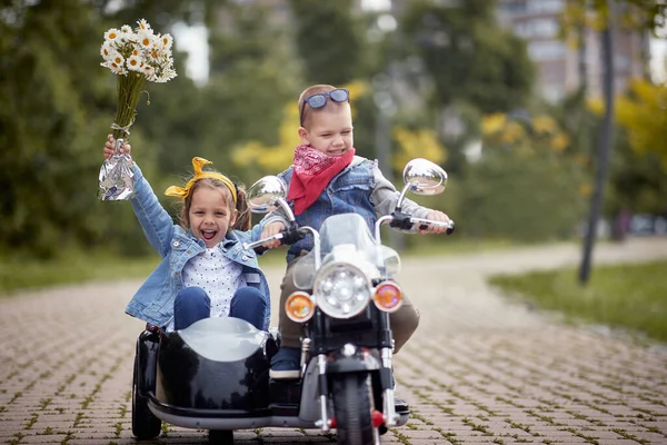 Happy Caucasian Kids Autumn Park Driving Motorcycle Toy — Stock Photo, Image