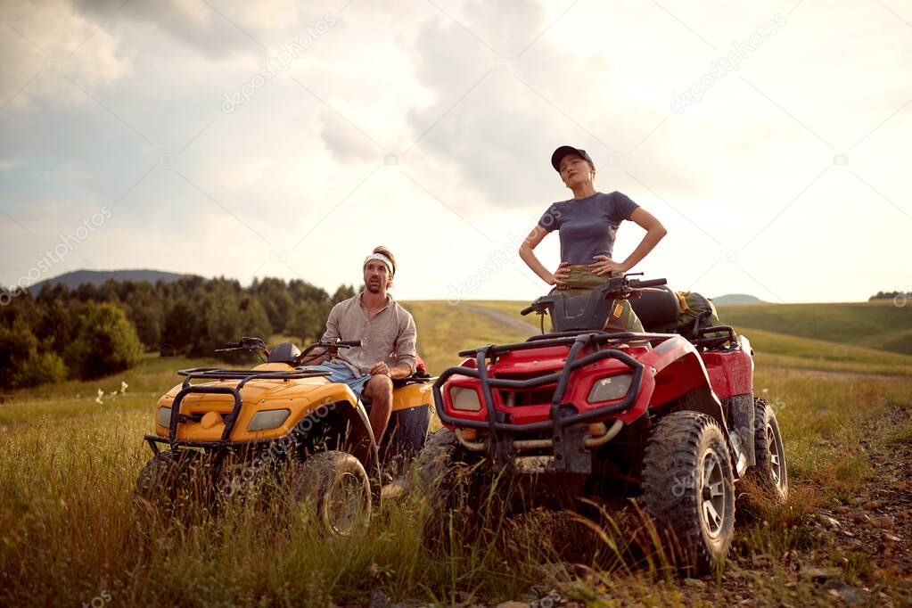 man and woman lover driving off-road and enjoying on extreme riding 