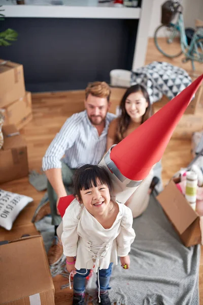 Top View Happy Little Girl Playing Her Parents Paper Rocket — Stockfoto