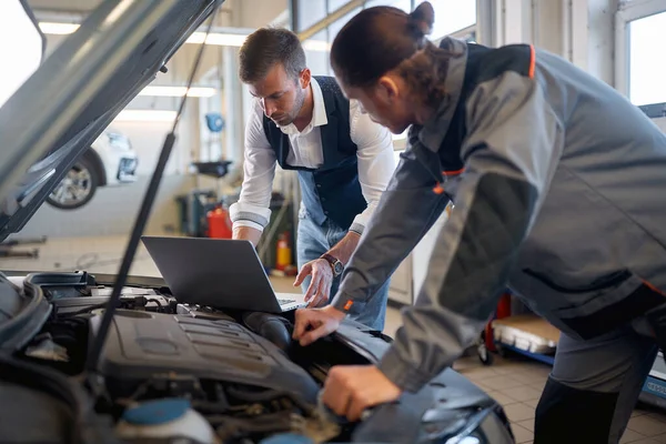 Two Men Auto Service Repairing Car Engin — 스톡 사진