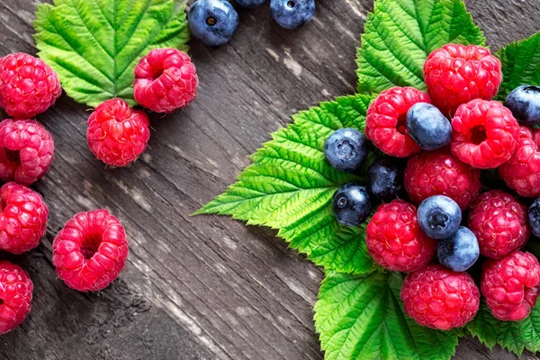 Raspberry Blueberry Different Berries Leaves Wooden Tabl — Photo