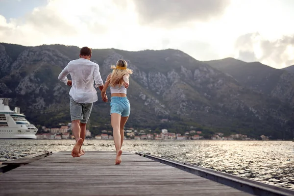 Rear View Romantic Couple Running Wooden Dock Holding Hands Travel — Fotografia de Stock