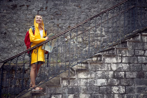 Happy Woman Yellow Raincoat Map Enjoying Rainy Day — Stock Fotó