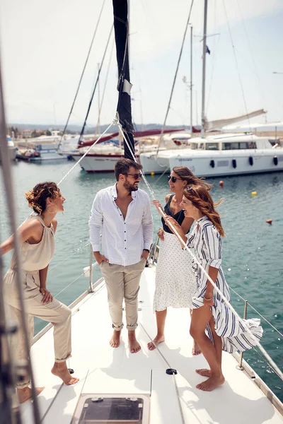 Group Young Handsome Models Standing Deck Yacht Talking While Riding — Fotografia de Stock