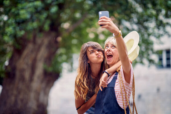 Young Women Making Funny Goofy Face Expressions Taking Selfie Street Royalty Free Stock Photos