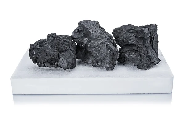 Black coal and white firelighter — Stock Photo, Image