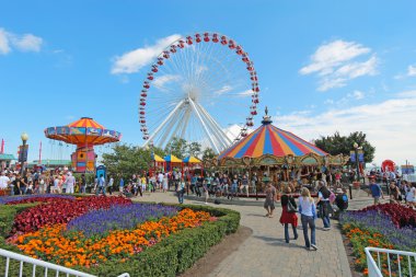 Carousel, ferris wheel and other rides at Navy Pier, Chicago clipart