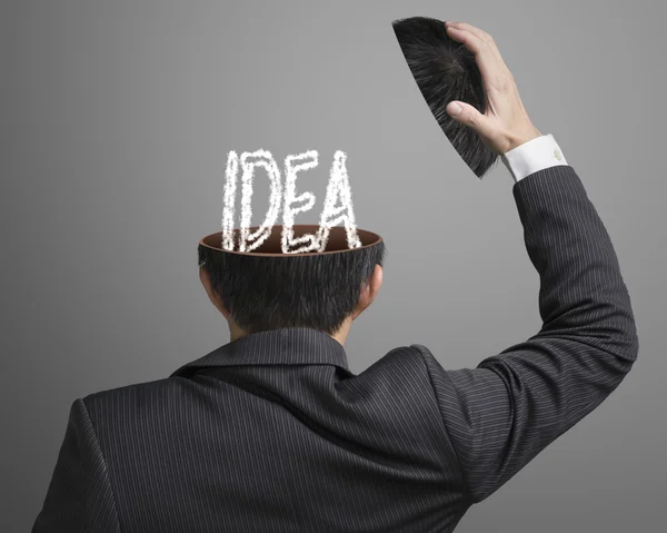 IDEA letter inside businessman head in gray background — Stock Photo, Image