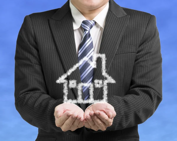 Palm opening business man with cloud shape house in blue sky bac — Stock Photo, Image