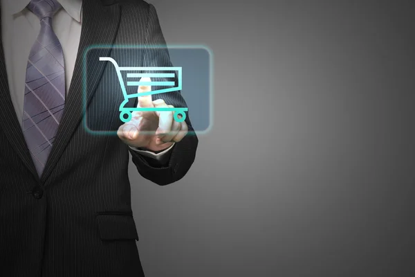 Businessman touch shopping cart icon for purchasing on line in g — Stock Photo, Image