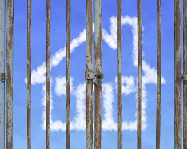 Locked door with cloud house in blue sky background — Stock Photo, Image