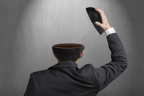 Without any idea inside businessman head in gray concrete wall b