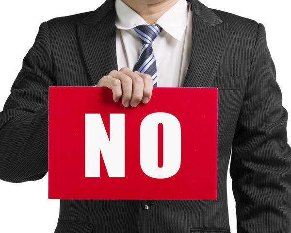 Businessman use one hand to hold a red board with word "No" clos