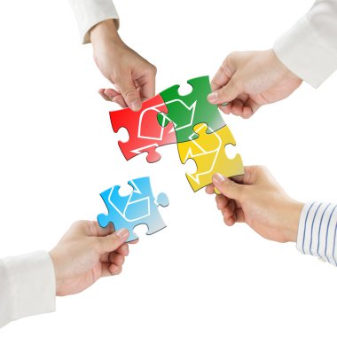 Hands hold puzzles with recycle symbol isolated in white backgro clipart