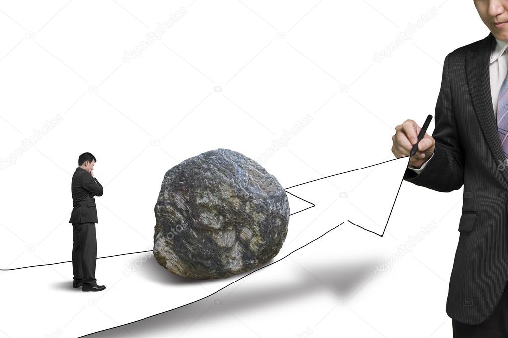 Businessman drawing road with growth arrow and large rock on the