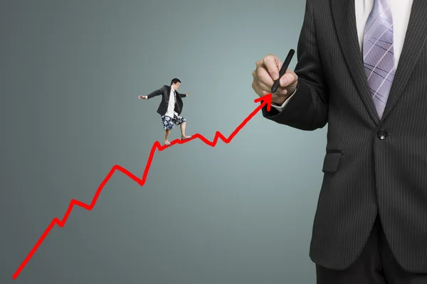 Businessman drawing growth red arrow and another surfing on it — Stock Photo, Image