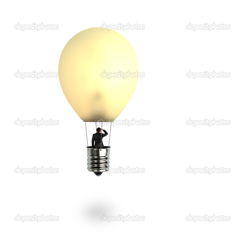 Man taking glowing lamp balloon looking at distant place