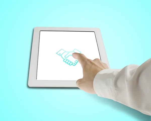 Hand touching shaking hand icon on tablet — Stock Photo, Image