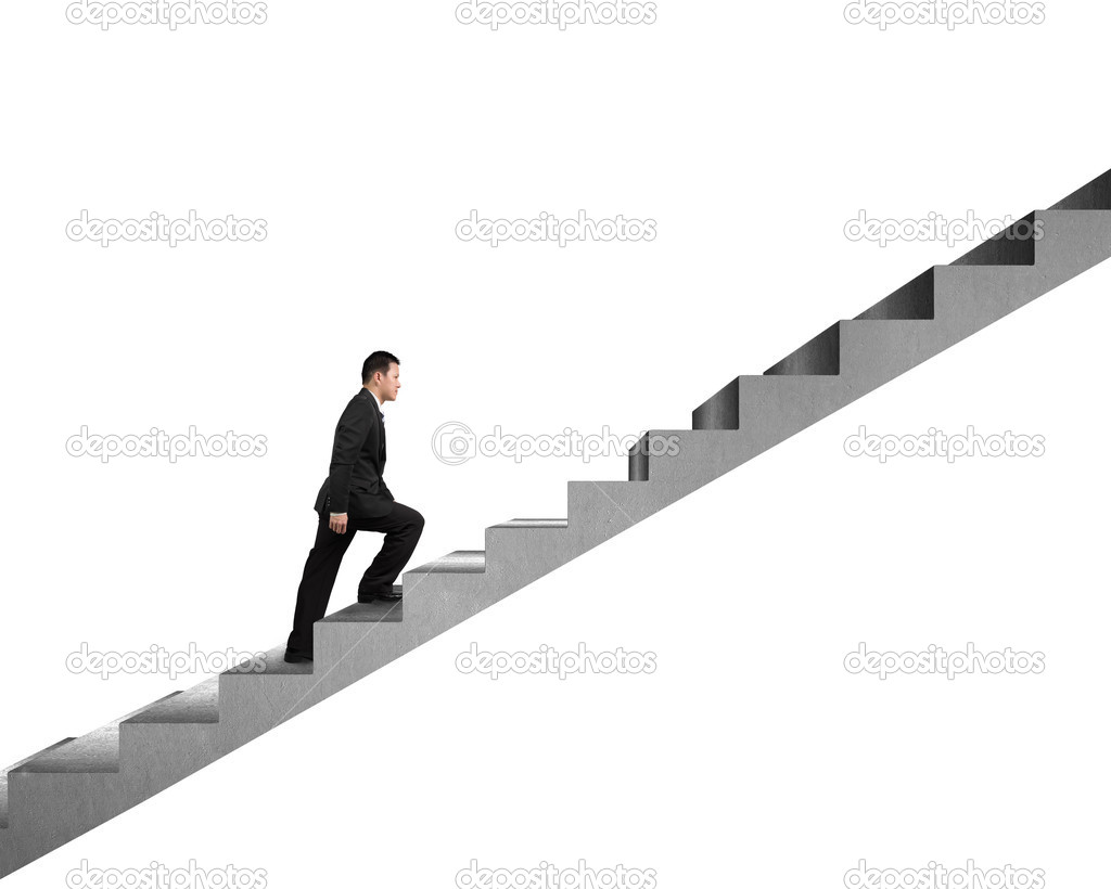 Businessman climbing on concrete stair isolated in white