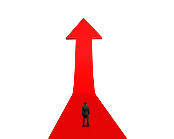 Podnikatel stojící a čelí rostoucí červená šipka — Stock fotografie