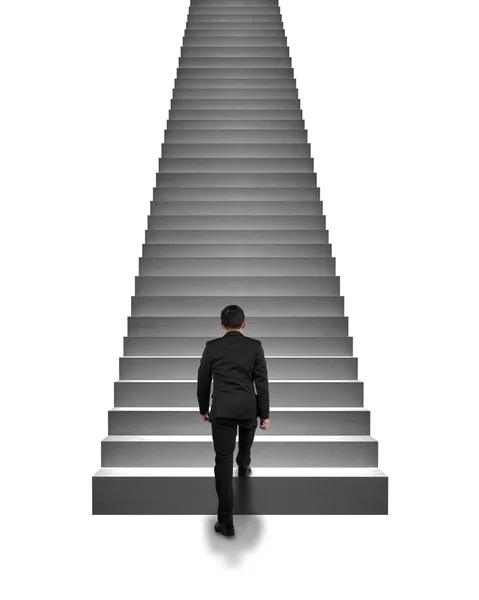 Rear view businessman climbing on stairs isolated in white — Stock Photo, Image