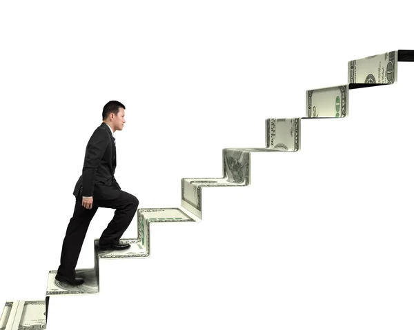お金の階段の上を歩くビジネスマン — ストック写真