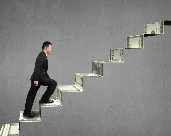 Climbing on money stairs — Stock Photo, Image