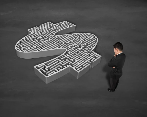 Standing in front of 3d money shape maze — Stock Photo, Image