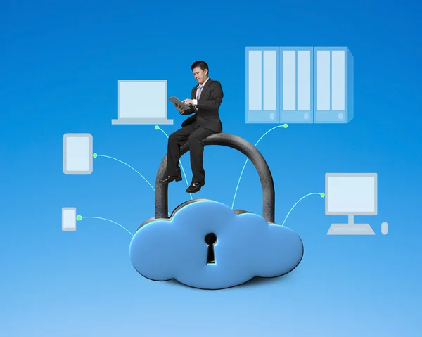 Using tablet and sitting on cloud shape locker — Stock Photo, Image