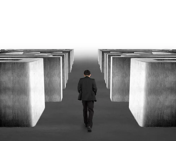 Man walking through 3d concrete maze — Stock Photo, Image