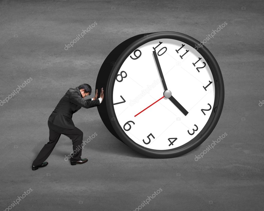 Businessman rolling clock 