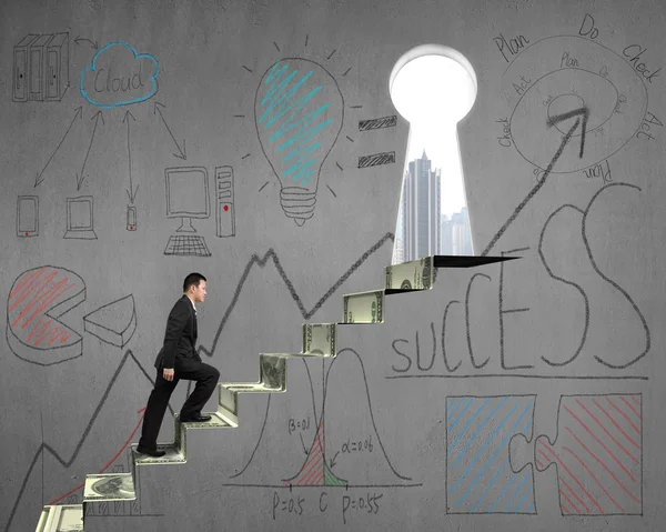 Climbing on money stairs with business concept doodles on wall — Stock Photo, Image