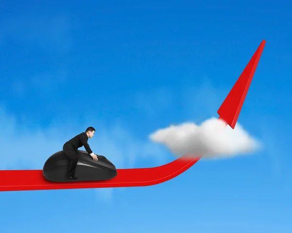 Riding computer mouse on growing red arrow — Stock Photo, Image