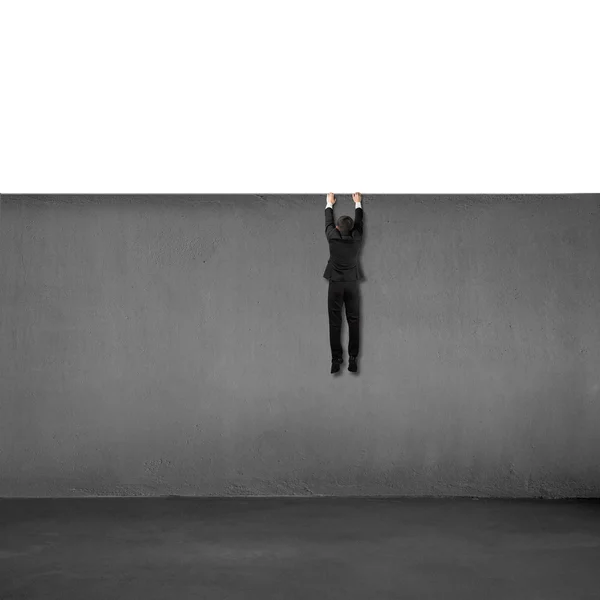 Trying to climb over wall — Stock Photo, Image