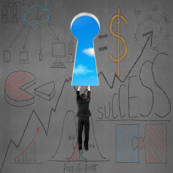 Climbing to key shape door with business doodles — Stock Photo, Image
